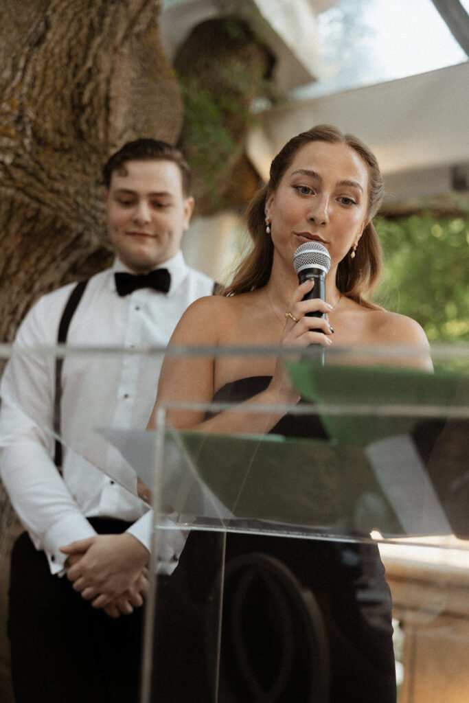 Graydon Hall Manor wedding reception in Toronto gardens with emotional wedding speeches