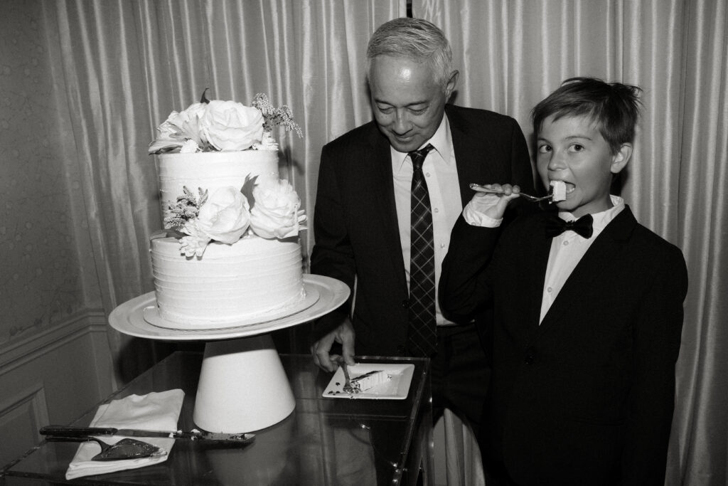 candid cake cutting at graydon hall manor during summer wedding