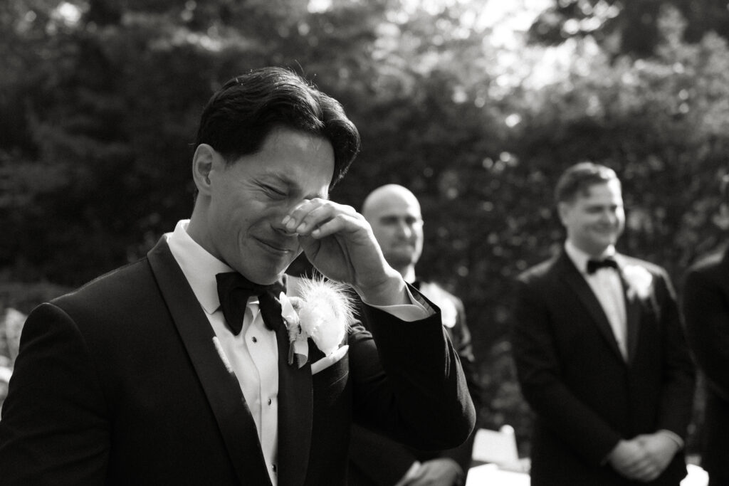 Graydon Hall Manor wedding ceremony in Toronto gardens, emotional groom